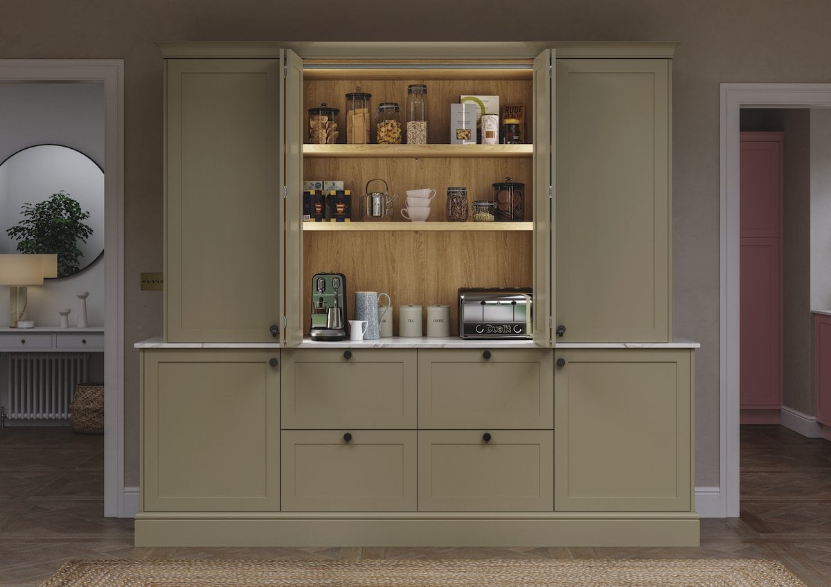 Breakfast bar in a traditional green kitchen