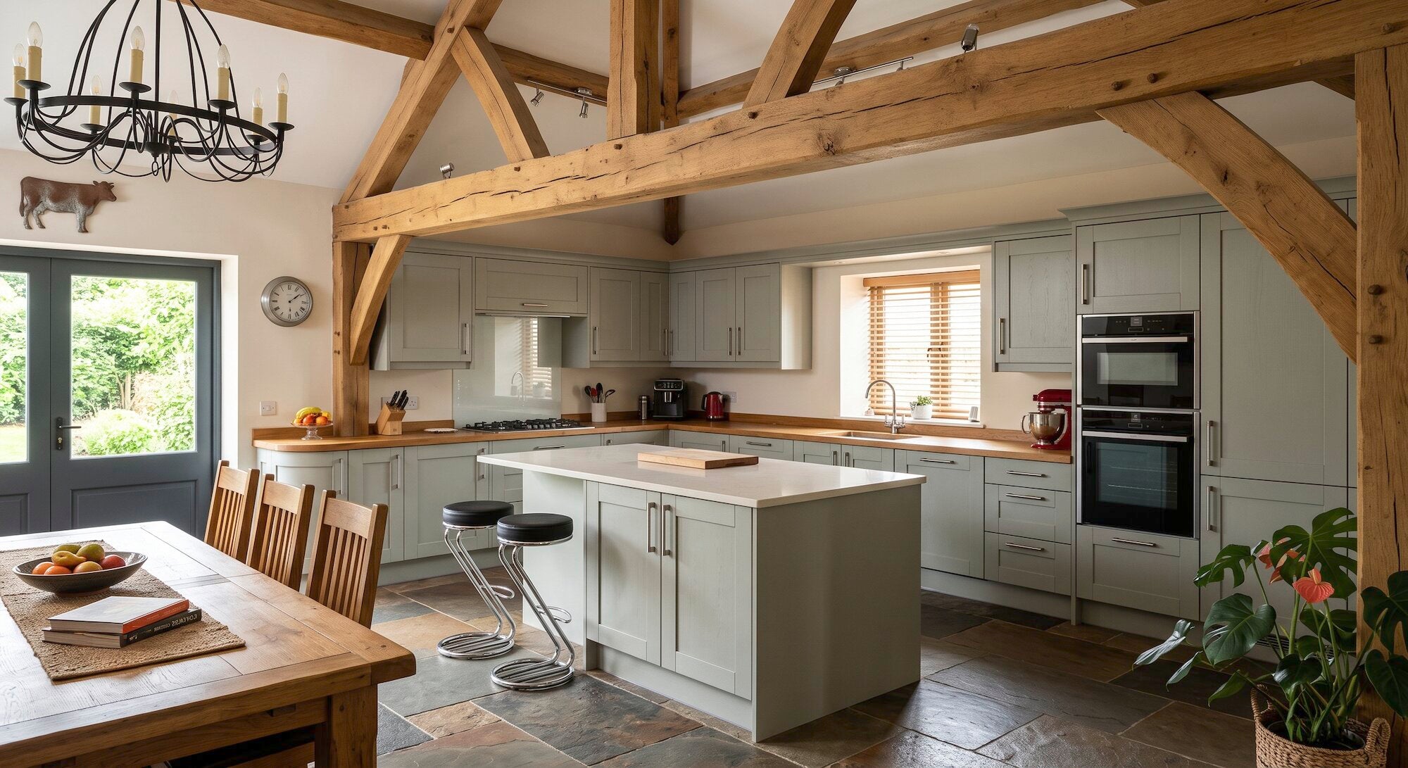 Pastel green bespoke kitchen in a country cottage in Essex